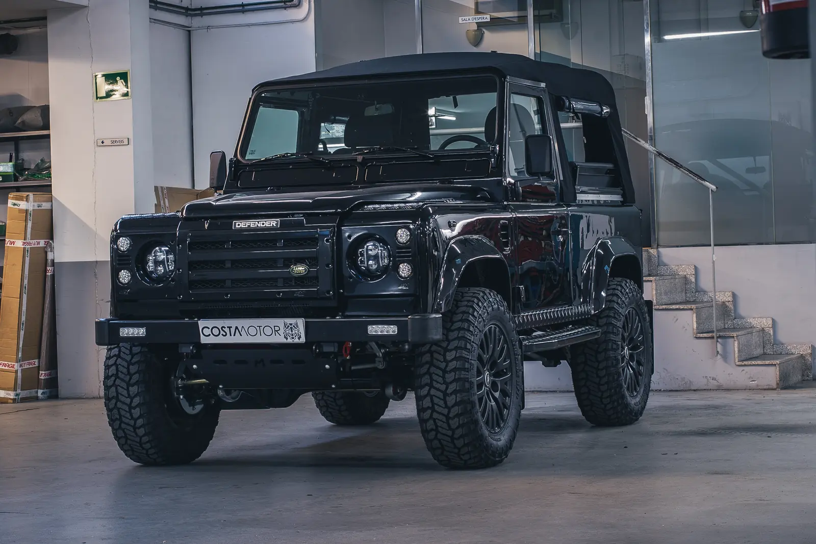 Defender 90 Apolo restored by Costa Motor — workshop foreground