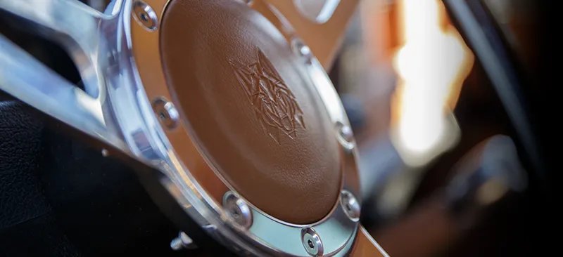 Hand-stitched leather steering wheel — Costa Motor Defender detail