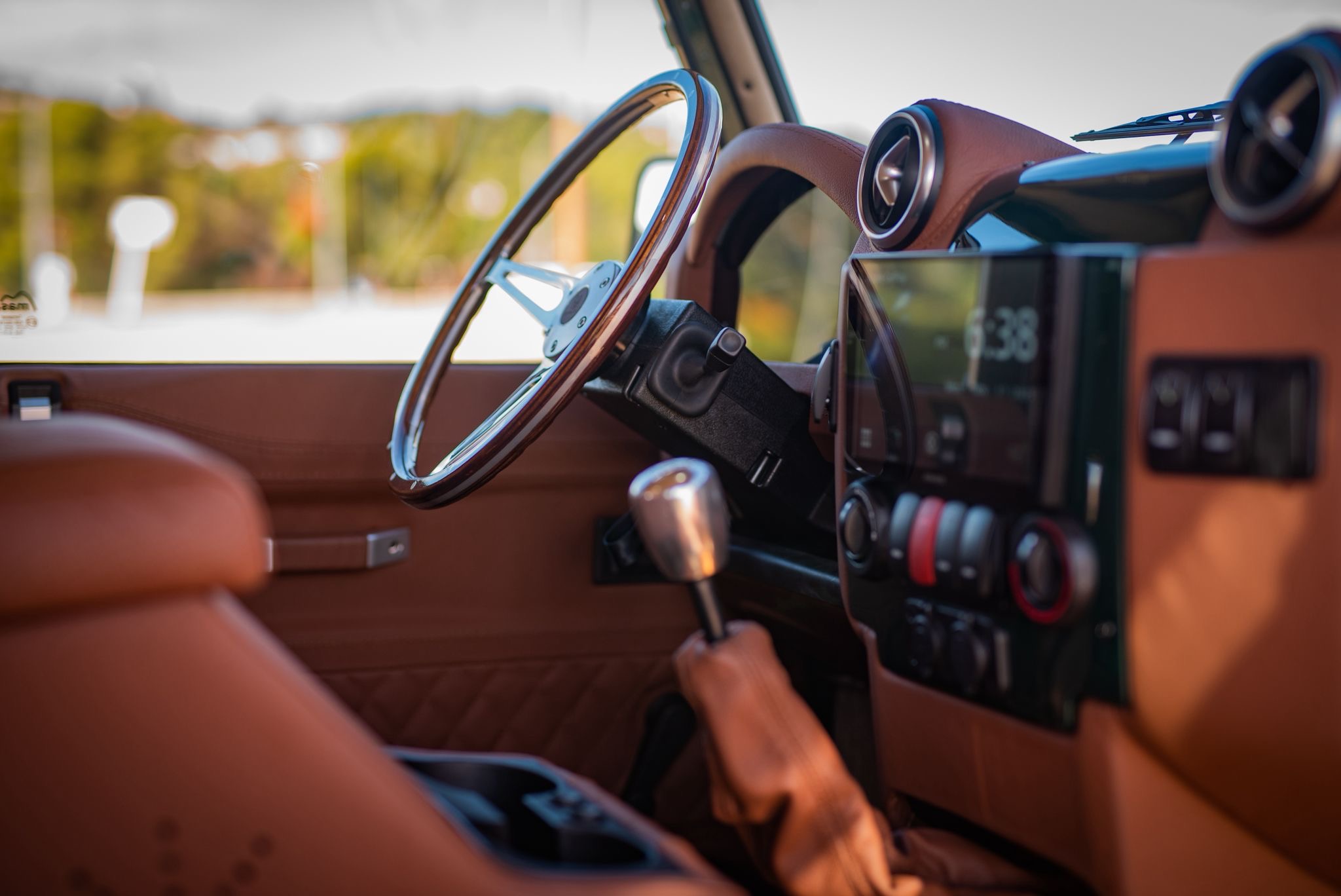 Land Rover Defender Falcon restored by Costa Motor — wood wheel