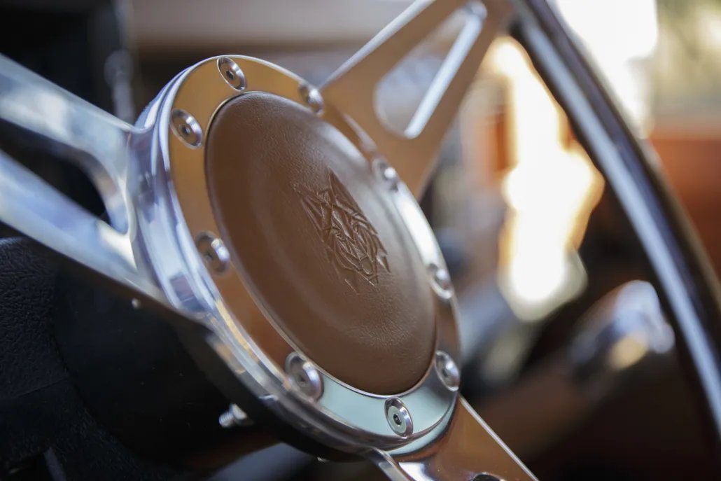 Steering wheel with embossed wolf emblem
